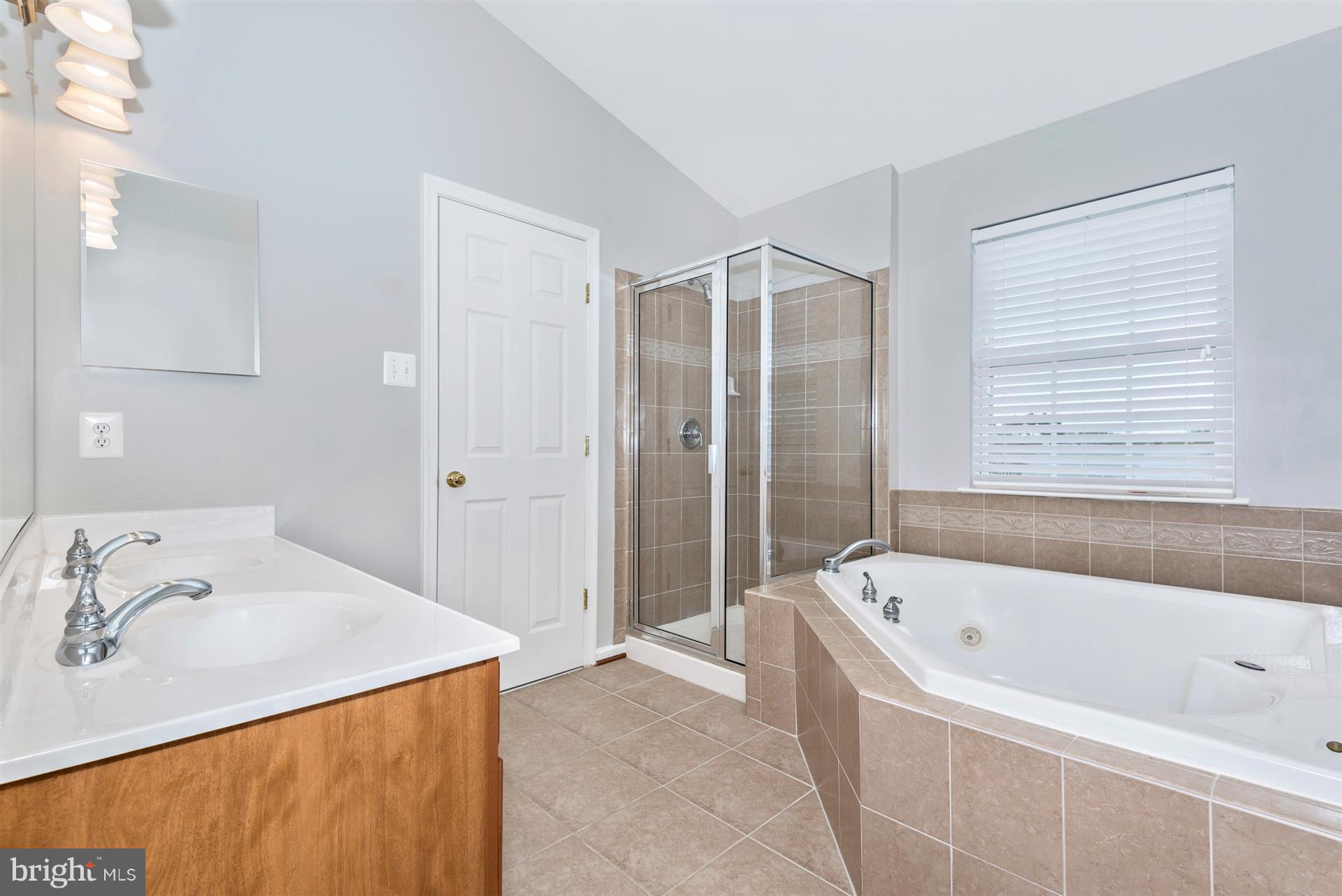 9854 Decatur Road Baltimore, MD 21220 - Photo 22 of 30 a bathroom with a tub sink and mirror
