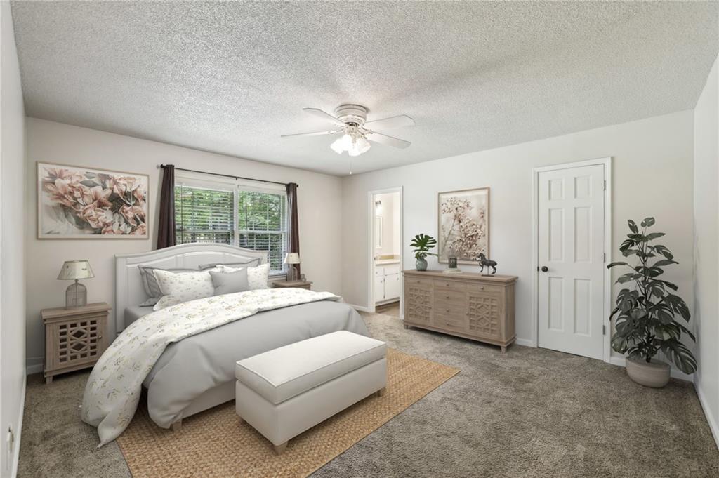 4645 Shallowford Road Roswell, GA 30075 - Photo 15 of 34 a bed room with a bed and a chandelier fan