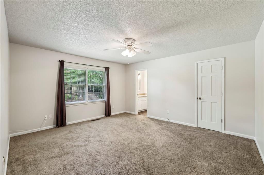 4645 Shallowford Road Roswell, GA 30075 - Photo 16 of 34 a view of an empty room with a window