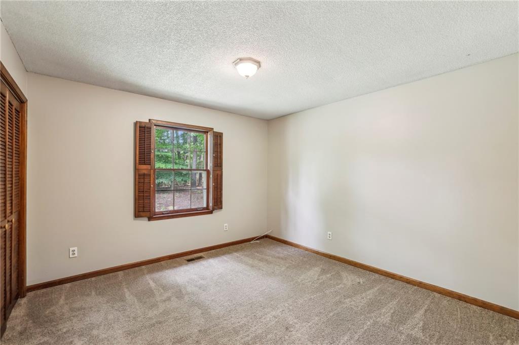 4645 Shallowford Road Roswell, GA 30075 - Photo 20 of 34 an empty room with windows