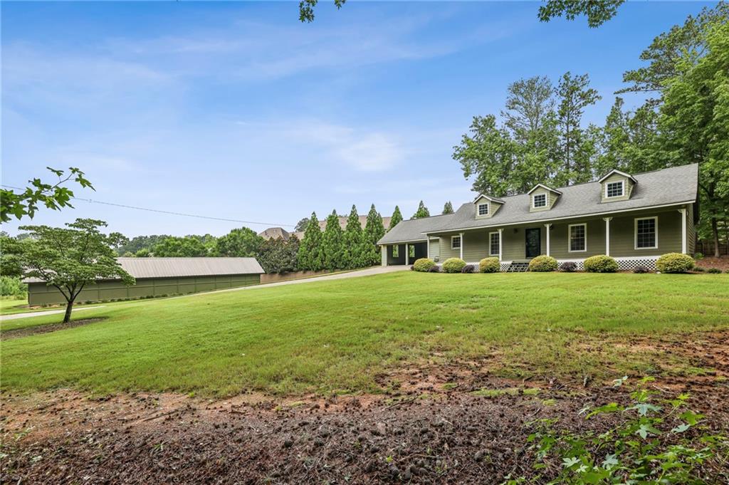 4645 Shallowford Road Roswell, GA 30075 - Photo 24 of 34 a front view of a house with a yard