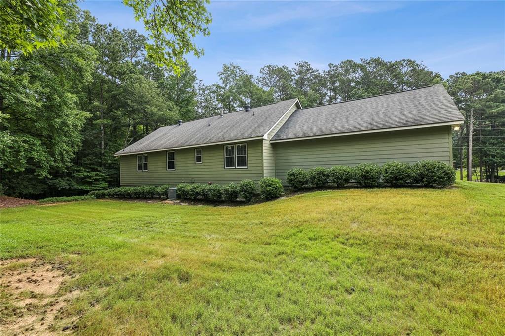 4645 Shallowford Road Roswell, GA 30075 - Photo 30 of 34 a front view of a house with a garden