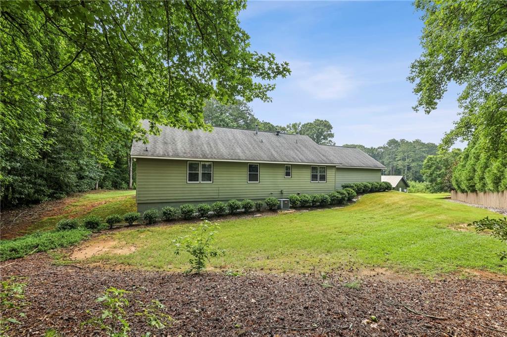 4645 Shallowford Road Roswell, GA 30075 - Photo 31 of 34 a front view of a house with yard