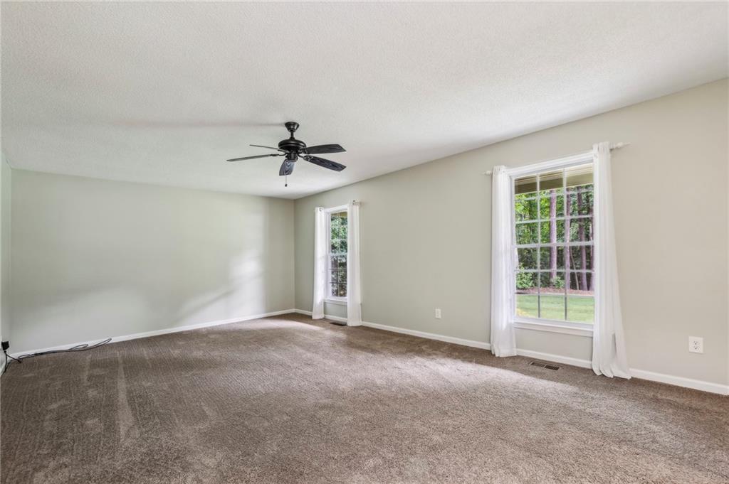 4645 Shallowford Road Roswell, GA 30075 - Photo 6 of 34 a view of an empty room with a window