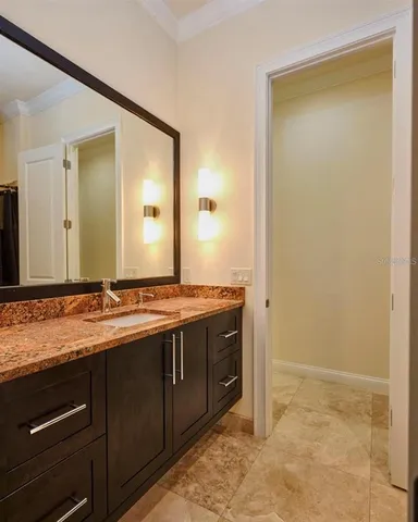 a kitchen with a stove and a large window