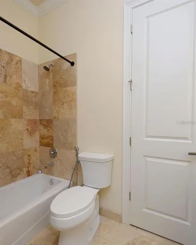 a view of a porch with wooden floor and garden