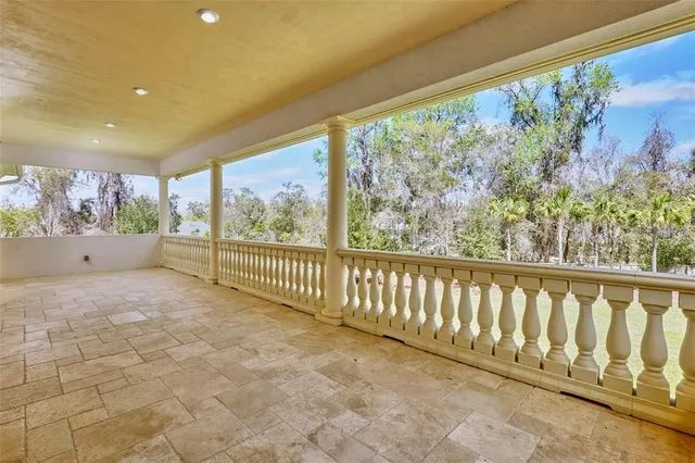 an aerial view of a house with yard swimming pool and outdoor seating