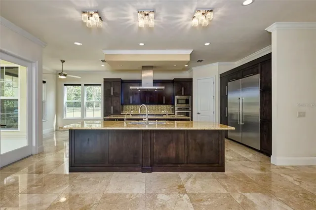 a living room with furniture and a ceiling fan