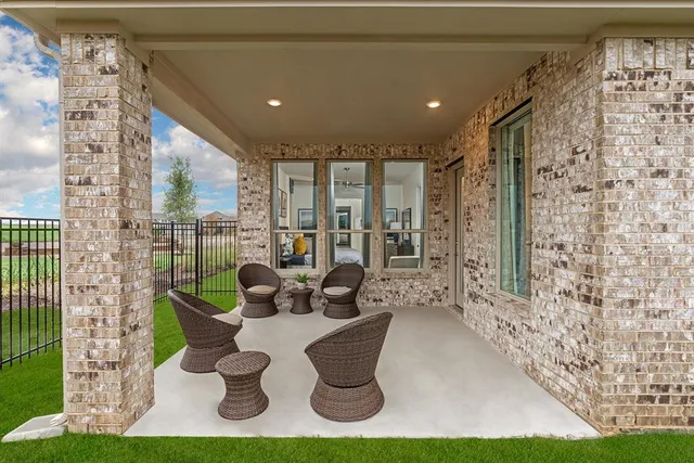 a kitchen with a sink and a stove top oven with wooden floor