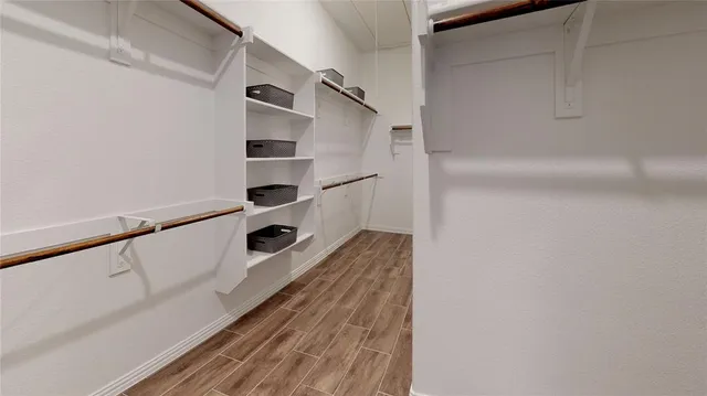 a view of an empty walk in closet