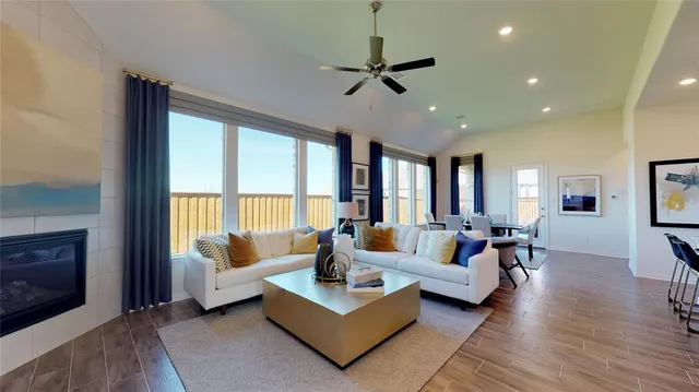 a living room with furniture and a large window