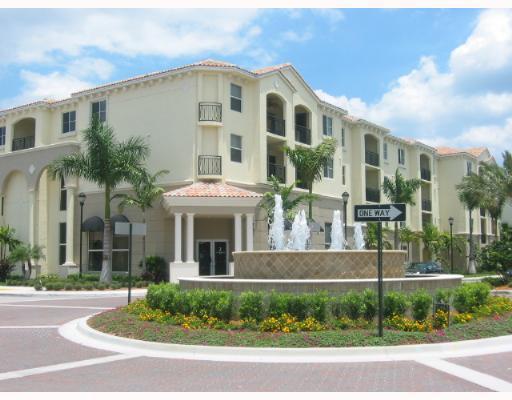 2 Renaissance Way, Unit 2320 Boynton Beach, FL 33426 - Photo 2 of 8 a front view of a house with a garden