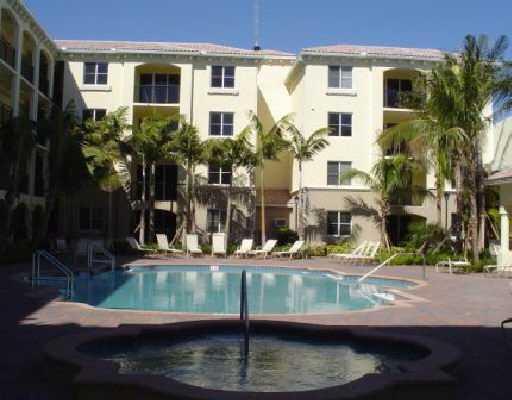 2 Renaissance Way, Unit 2320 Boynton Beach, FL 33426 - Photo 3 of 8 a view of building with small yard