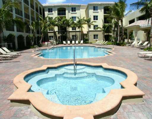 2 Renaissance Way, Unit 2320 Boynton Beach, FL 33426 - Photo 4 of 8 a view of a swimming pool with a yard