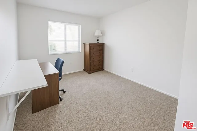 a workspace with furniture and window