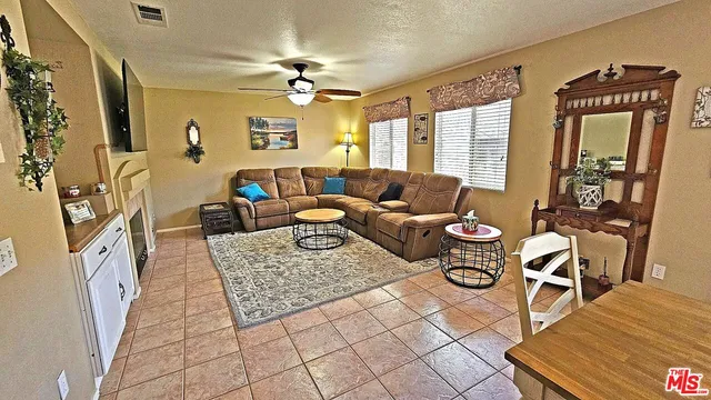 a living room with furniture and a table