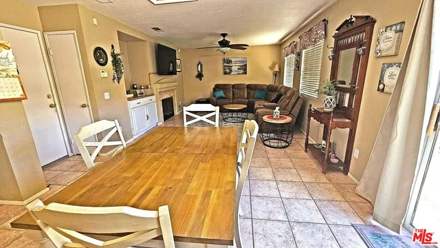 a living room with lots of furniture and a rug