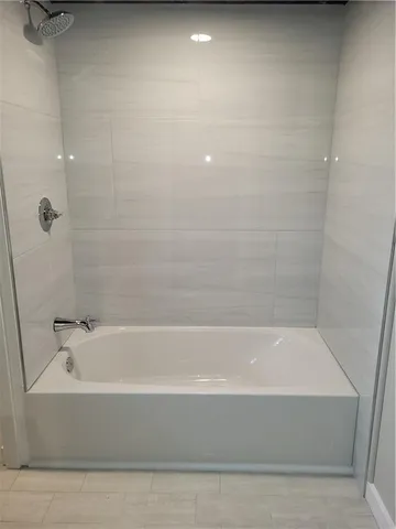 a backyard of a house with lots of green space and fountain