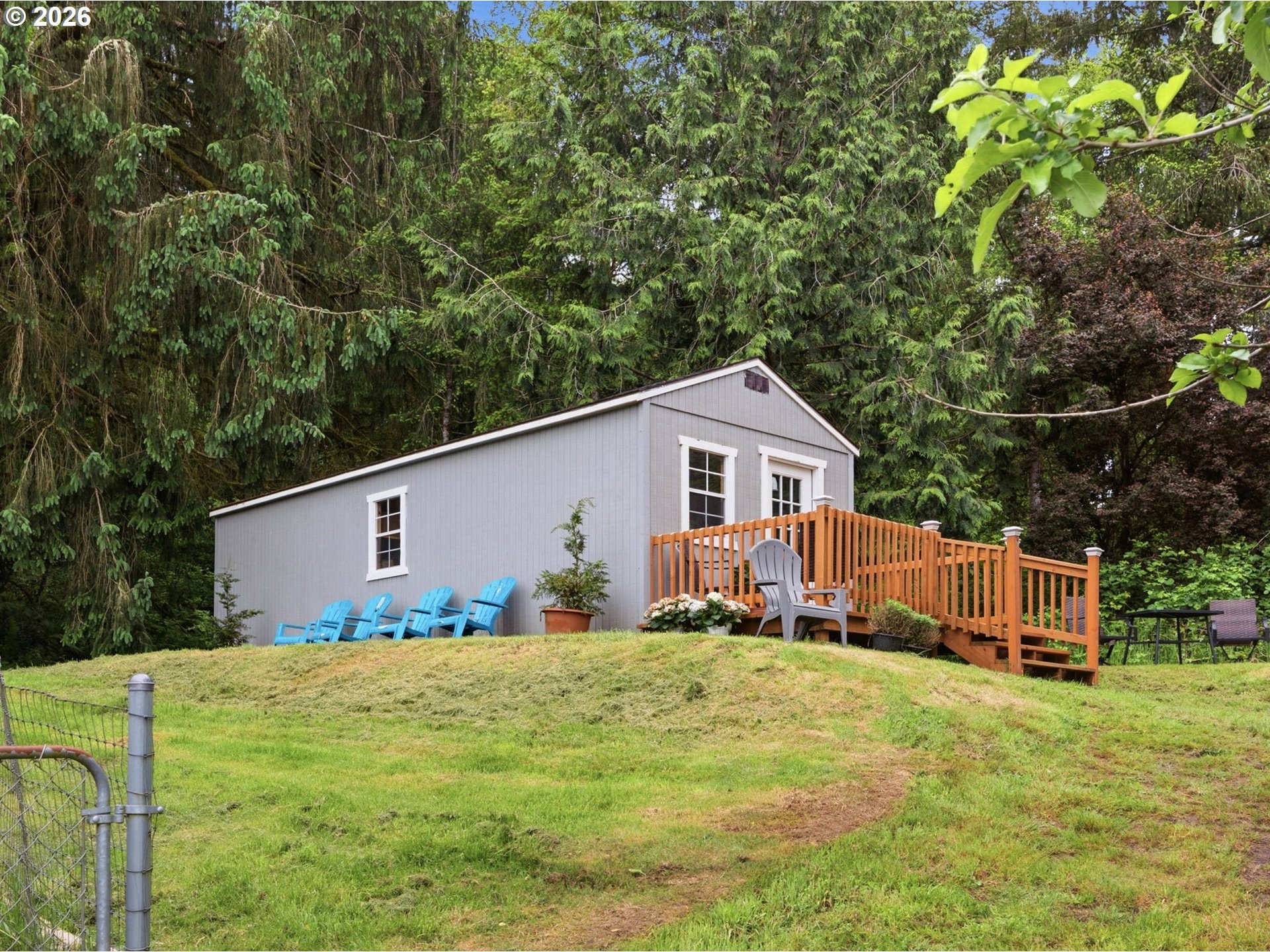 92085 Akerstedt Road Astoria, OR 97103 - Photo 35 of 48 a front view of house with yard and trees in the background