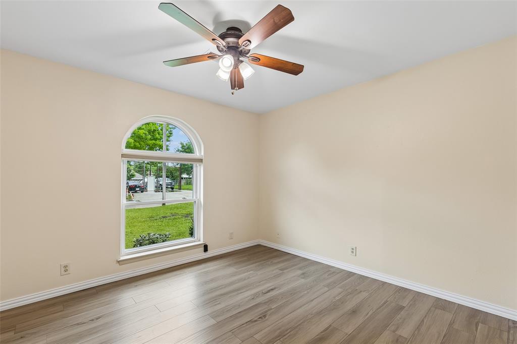 1548 Timbercreek Drive Howe, TX 75459 - Photo 15 of 24 an empty room with a window and a fan