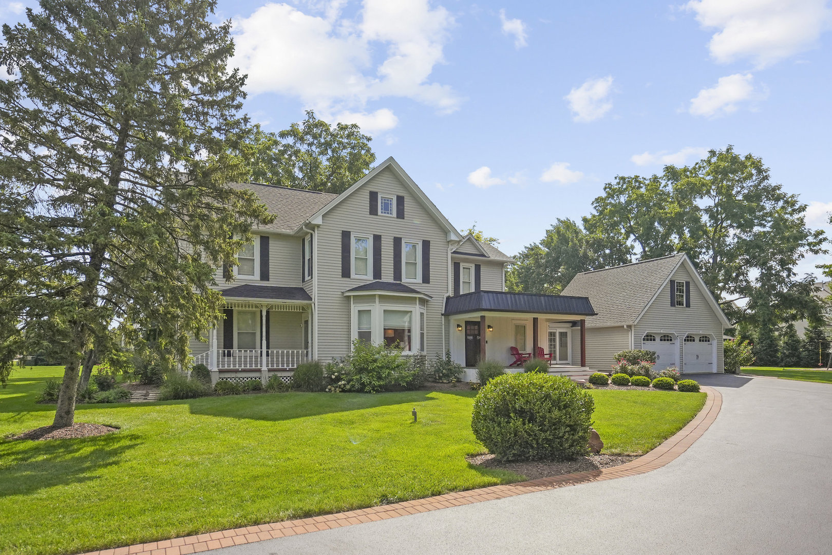 3614 Wolf Road Oswego, IL 60543 - Photo 2 of 56 a front view of a house with garden
