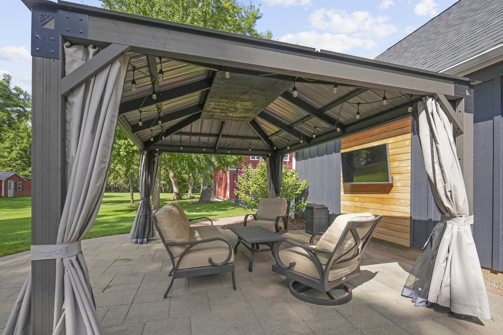 3614 Wolf Road Oswego, IL 60543 - Photo 38 of 56 a view of patio with a table and chairs under an umbrella with a small yard