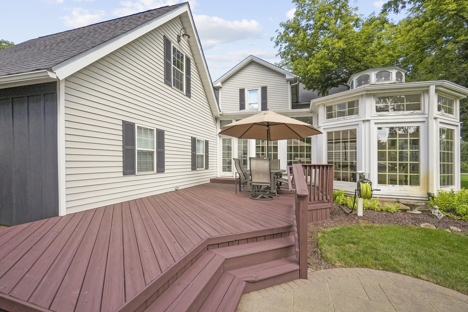 3614 Wolf Road Oswego, IL 60543 - Photo 41 of 56 a view of a house with a yard and sitting area