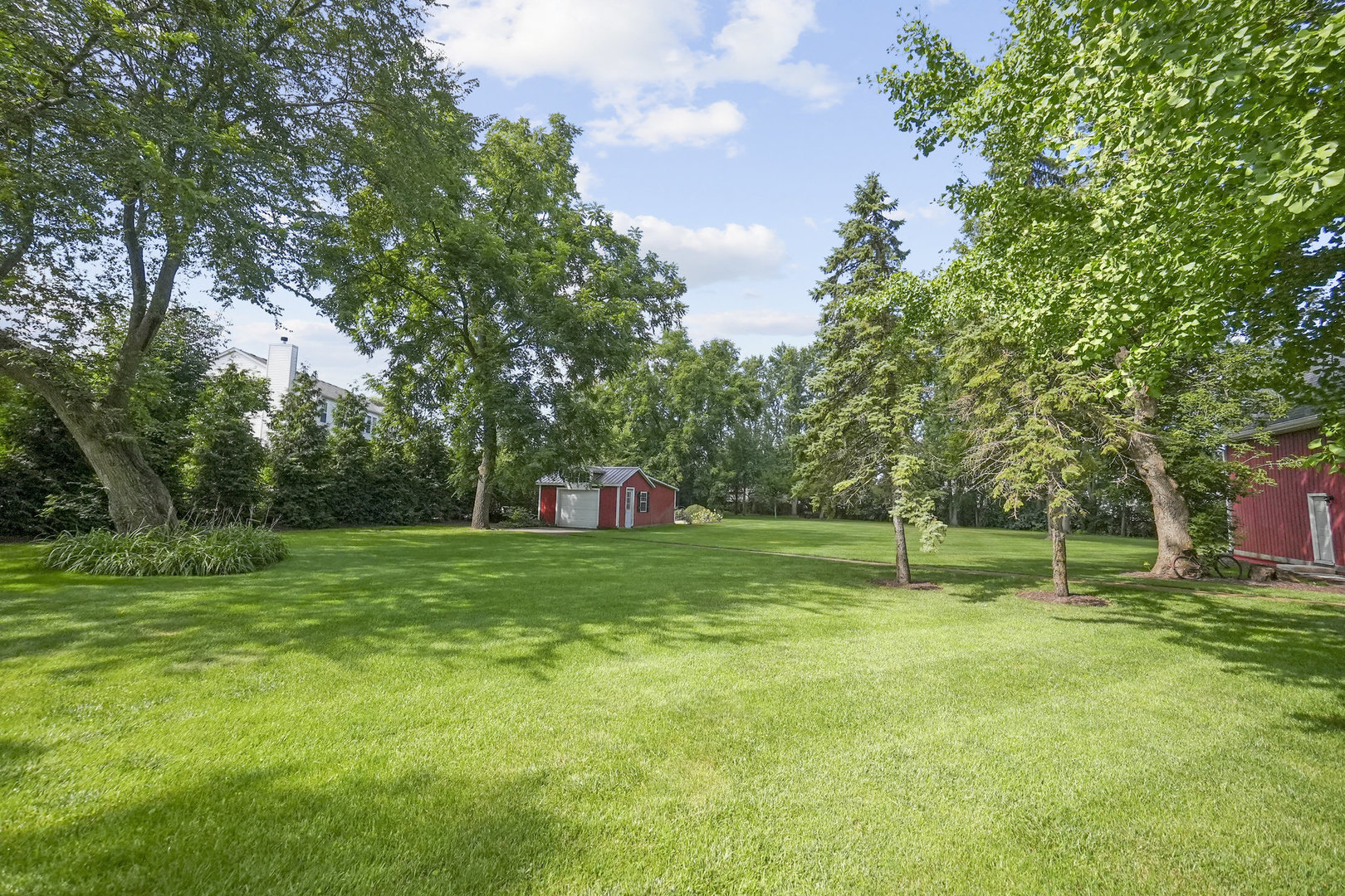 3614 Wolf Road Oswego, IL 60543 - Photo 52 of 56 a green field with lots of trees in it