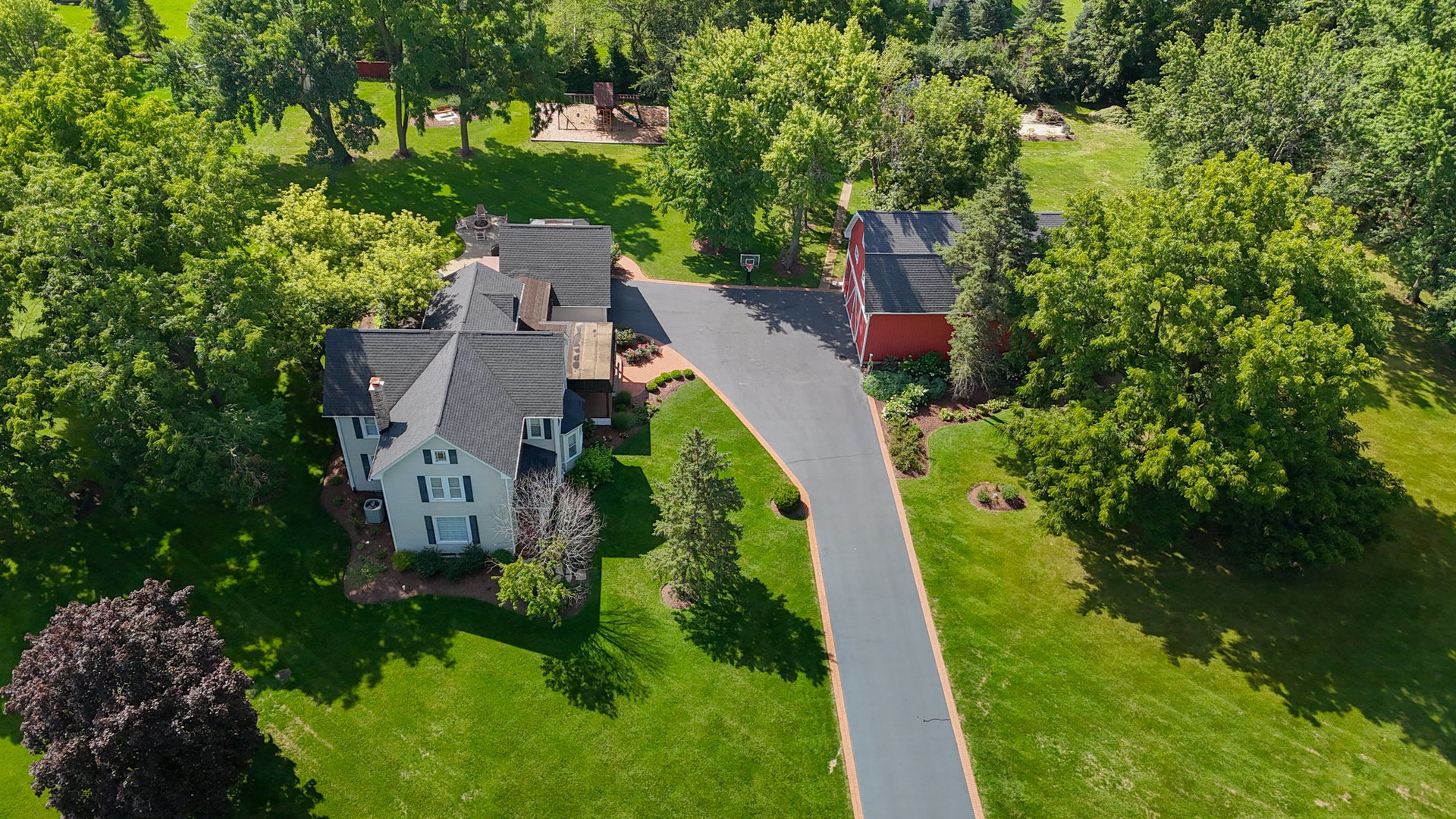 3614 Wolf Road Oswego, IL 60543 - Photo 54 of 56 an aerial view of a house with a yard and outdoor seating