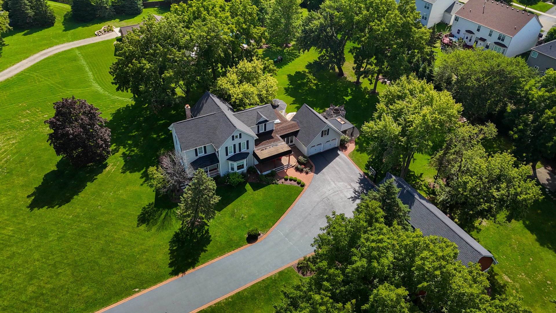 3614 Wolf Road Oswego, IL 60543 - Photo 55 of 56 an aerial view of a house with garden space and street view