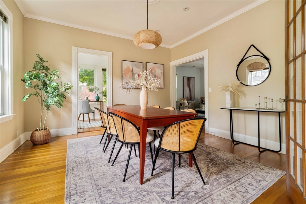 52 Walter Street Boston, MA 02131 - Photo 5 of 31 a view of a dining room with furniture and wooden floor