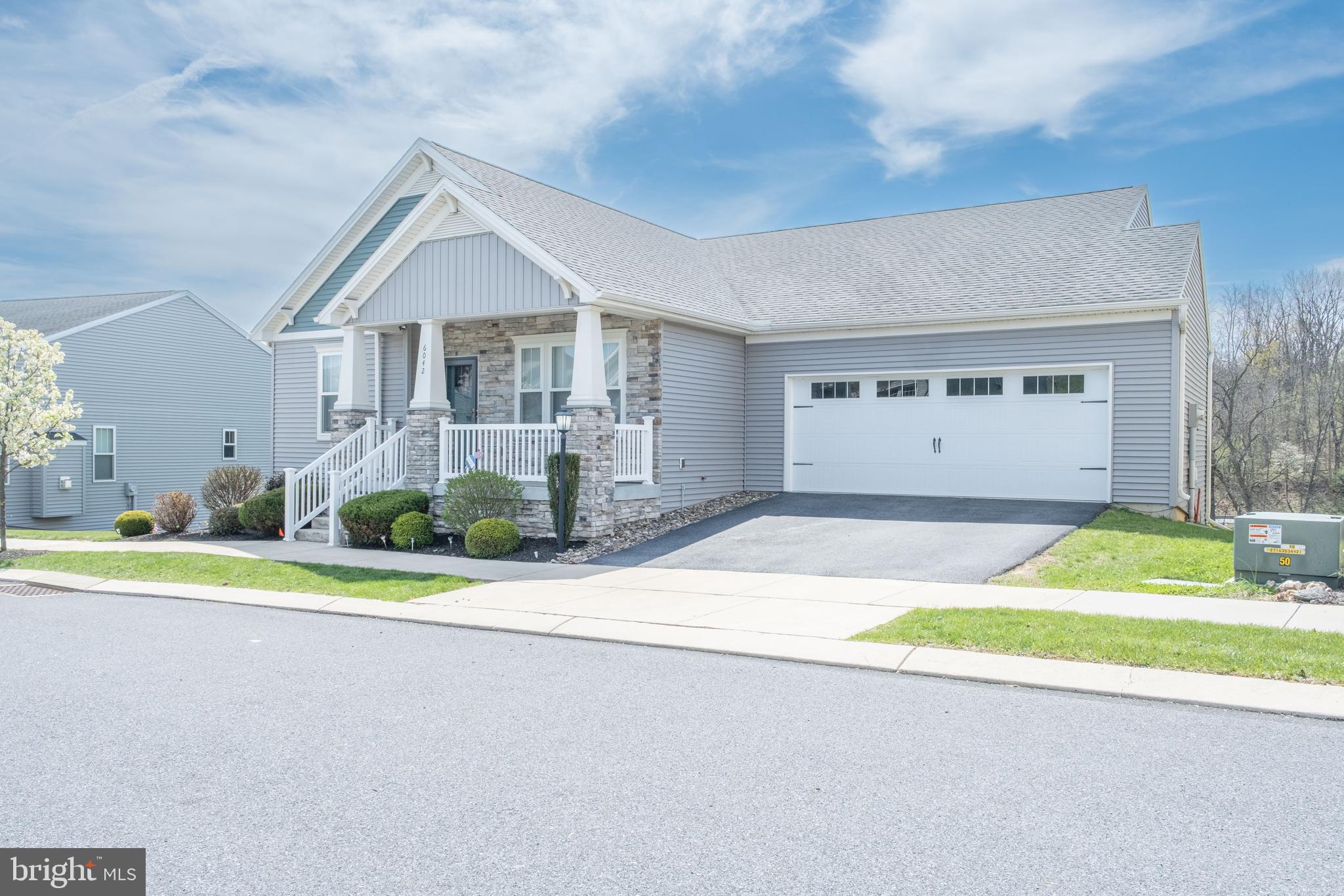 6042 Station Cir Road Harrisburg, PA 17111 - Photo 2 of 71 a front view of a house with a yard and garage