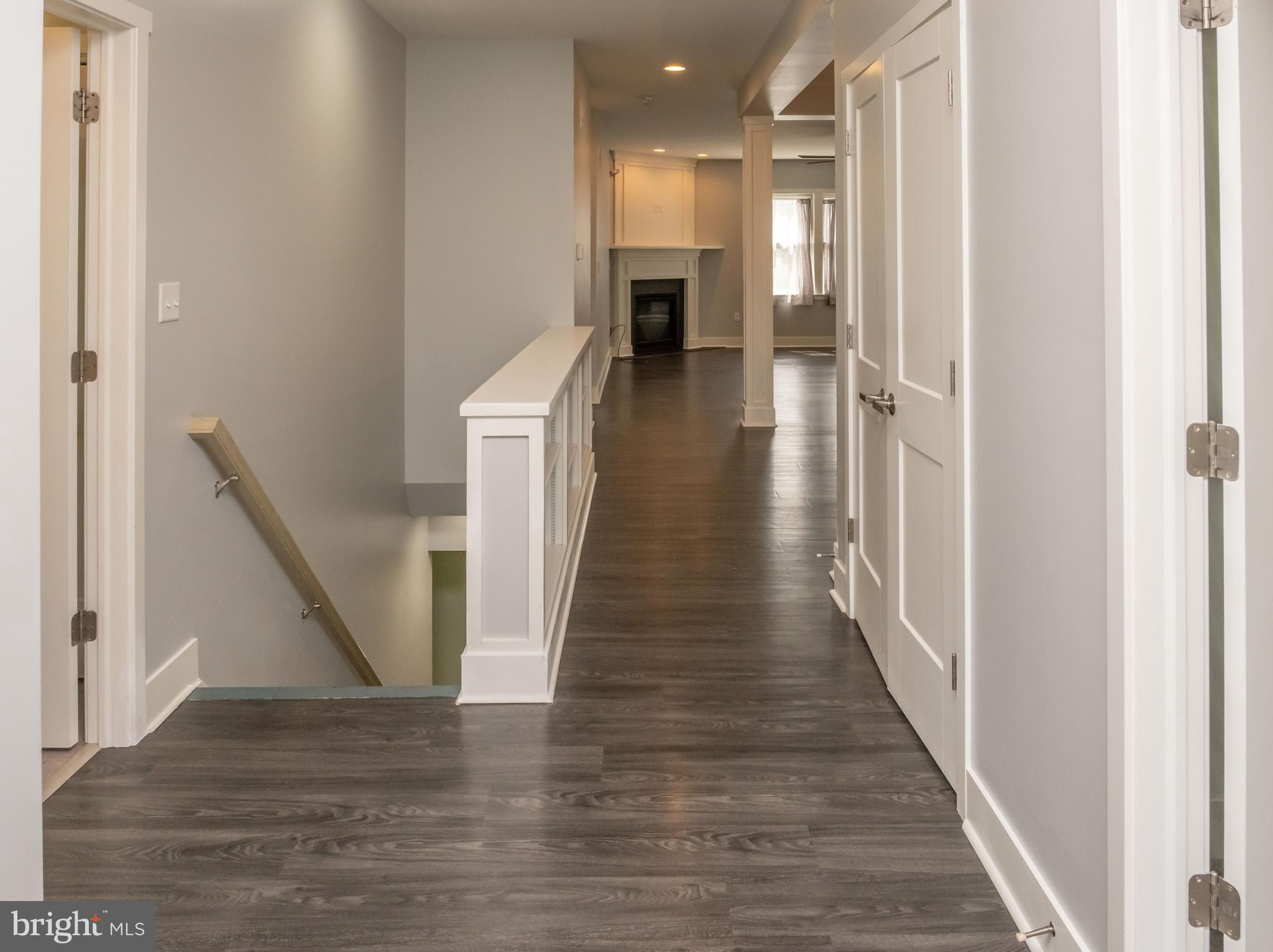 6042 Station Cir Road Harrisburg, PA 17111 - Photo 21 of 71 a view of a hallway with wooden floor and staircase