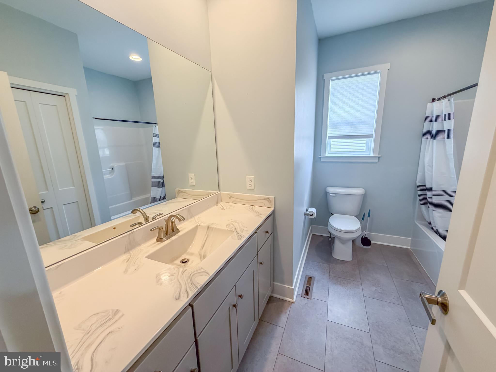 6042 Station Cir Road Harrisburg, PA 17111 - Photo 23 of 71 a spacious bathroom with a granite countertop sink toilet and shower