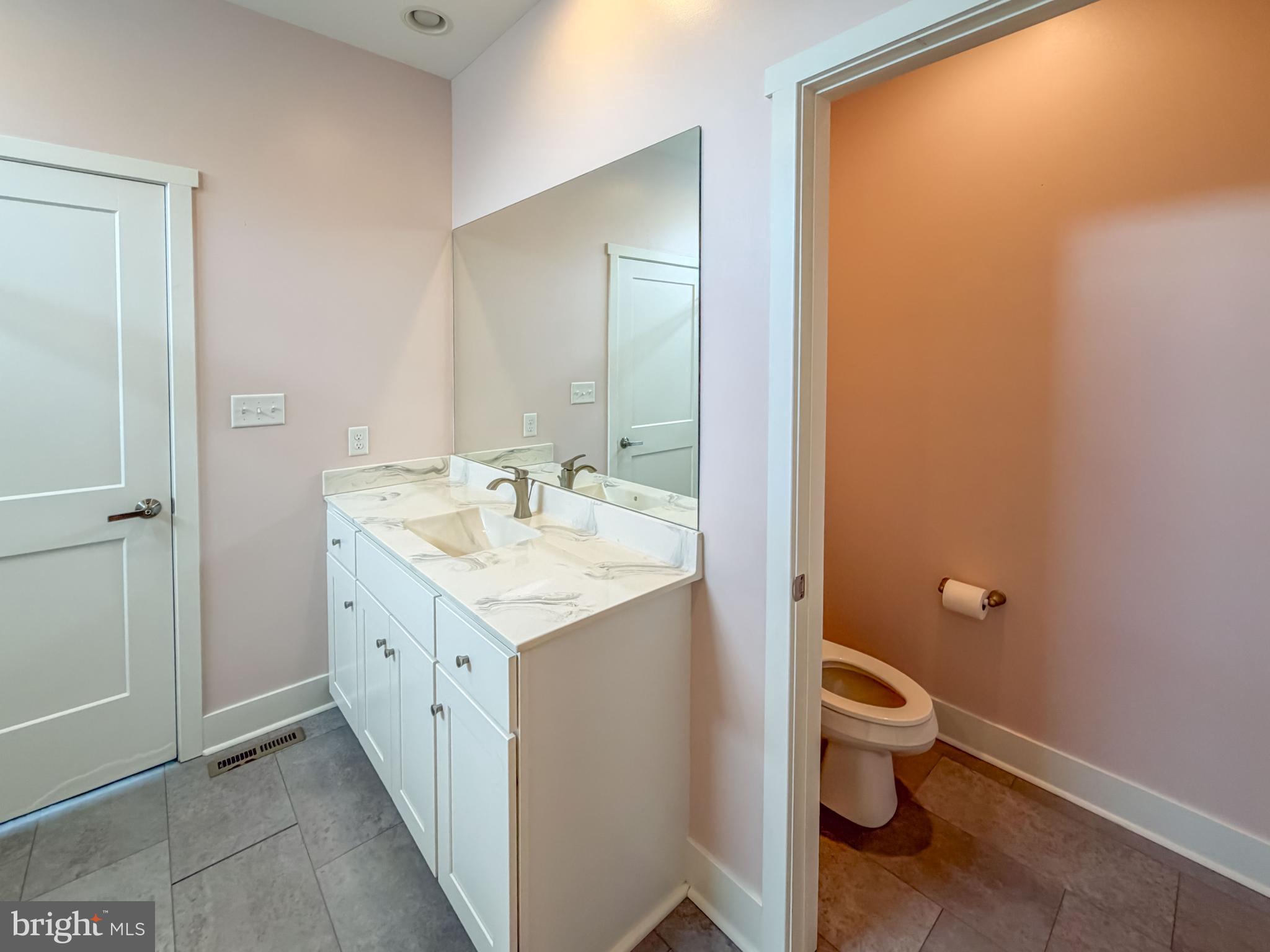 6042 Station Cir Road Harrisburg, PA 17111 - Photo 46 of 71 a spacious bathroom with a granite countertop sink and a mirror