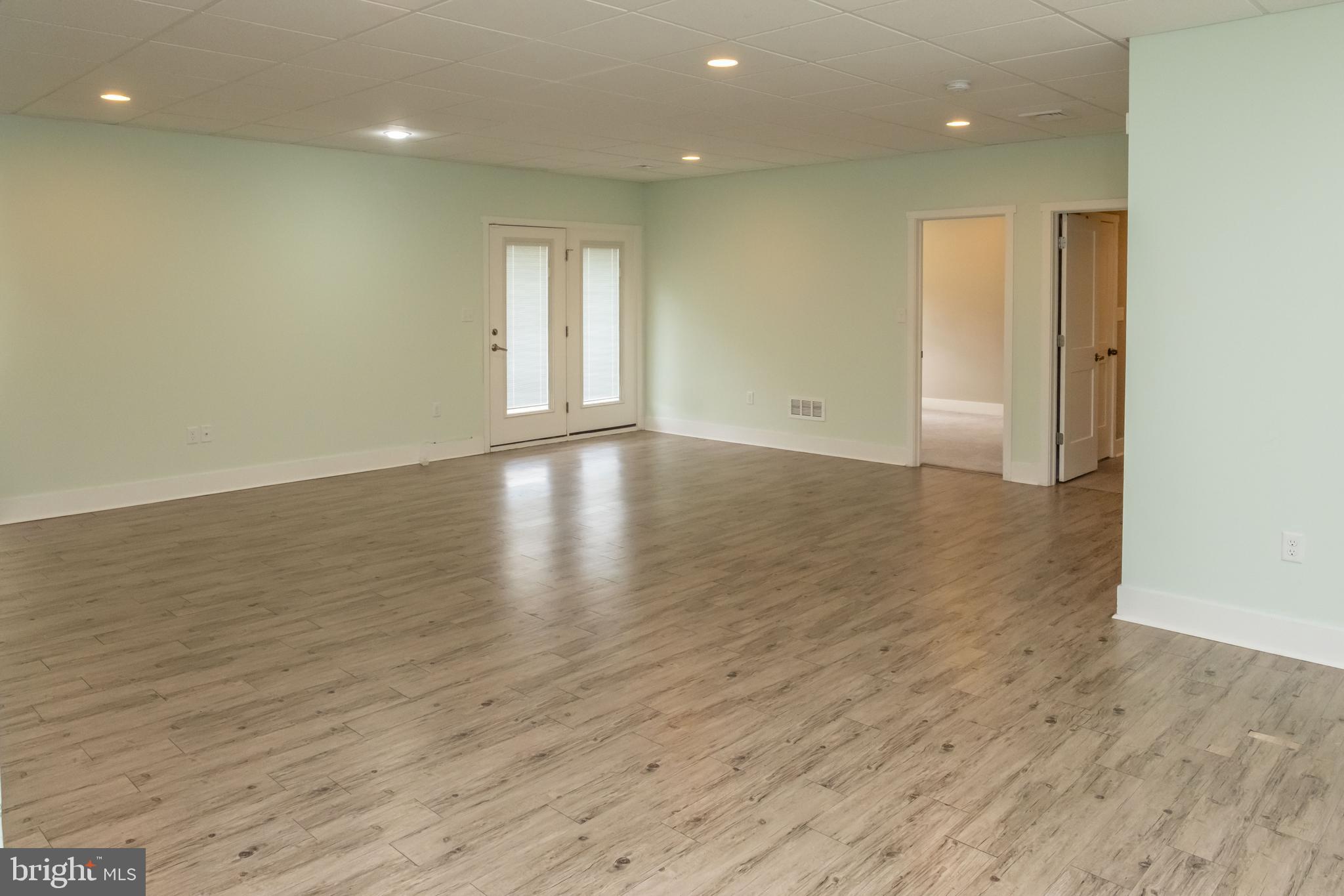 6042 Station Cir Road Harrisburg, PA 17111 - Photo 51 of 71 an empty room with wooden floor and windows