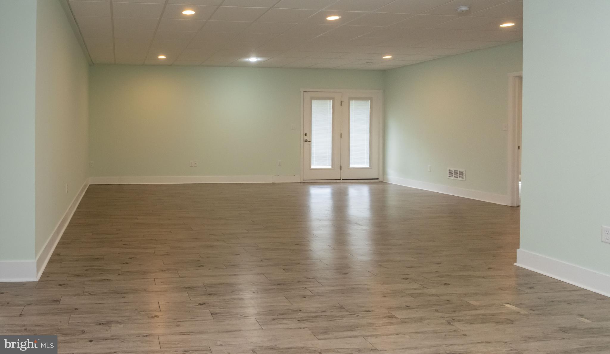 6042 Station Cir Road Harrisburg, PA 17111 - Photo 52 of 71 a view of an empty room with wooden floor and a window