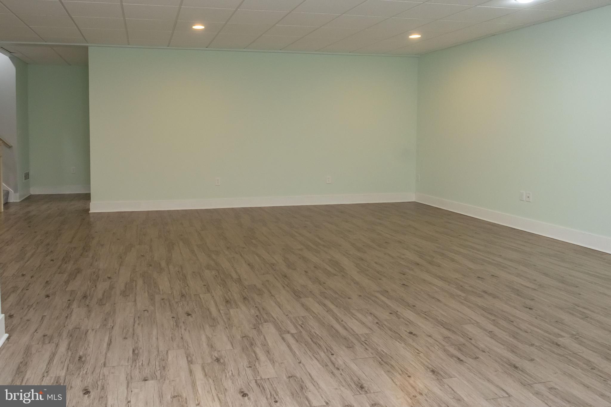 6042 Station Cir Road Harrisburg, PA 17111 - Photo 60 of 71 a view of an empty room with wooden floor and a window