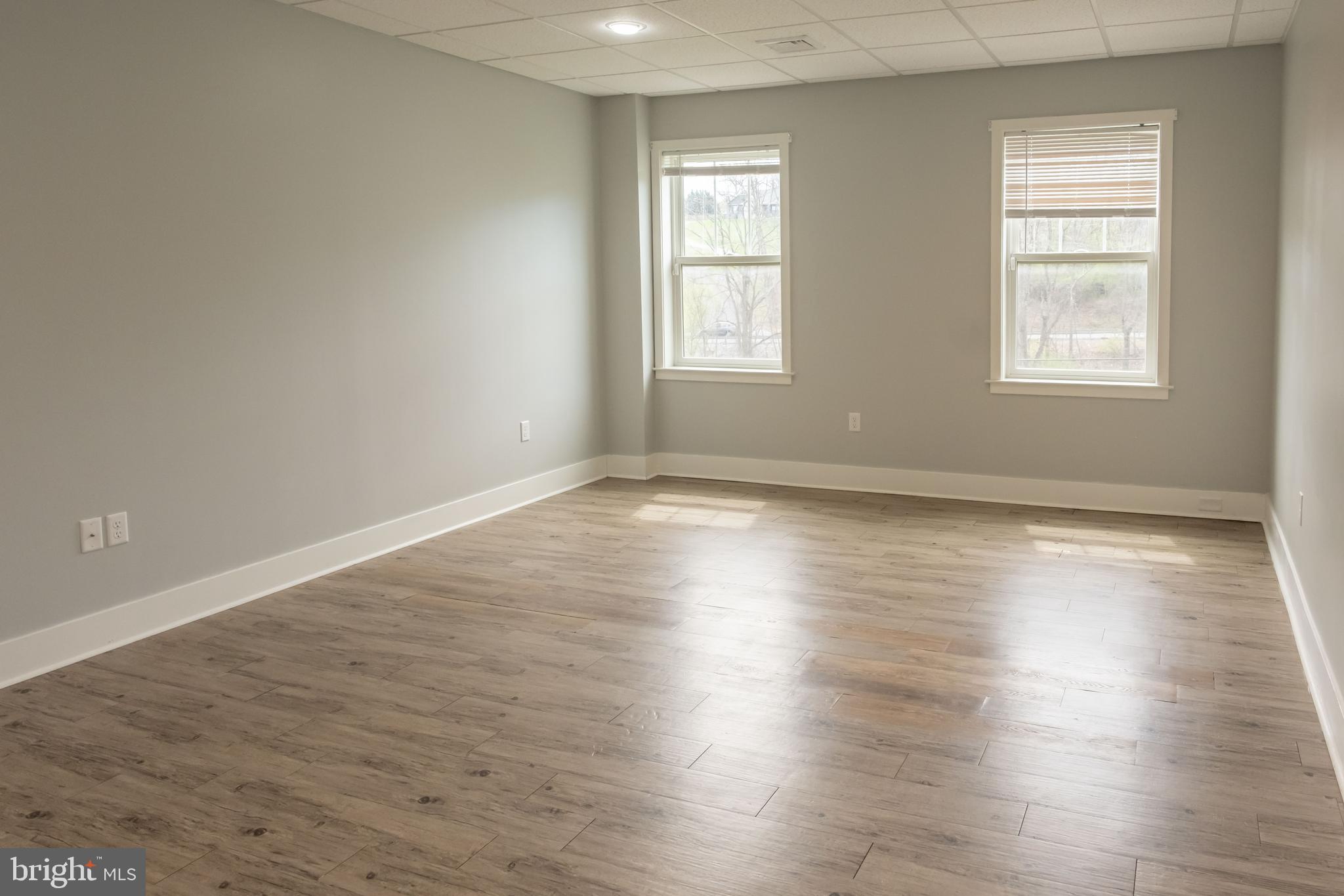 6042 Station Cir Road Harrisburg, PA 17111 - Photo 61 of 71 an empty room with wooden floor and windows