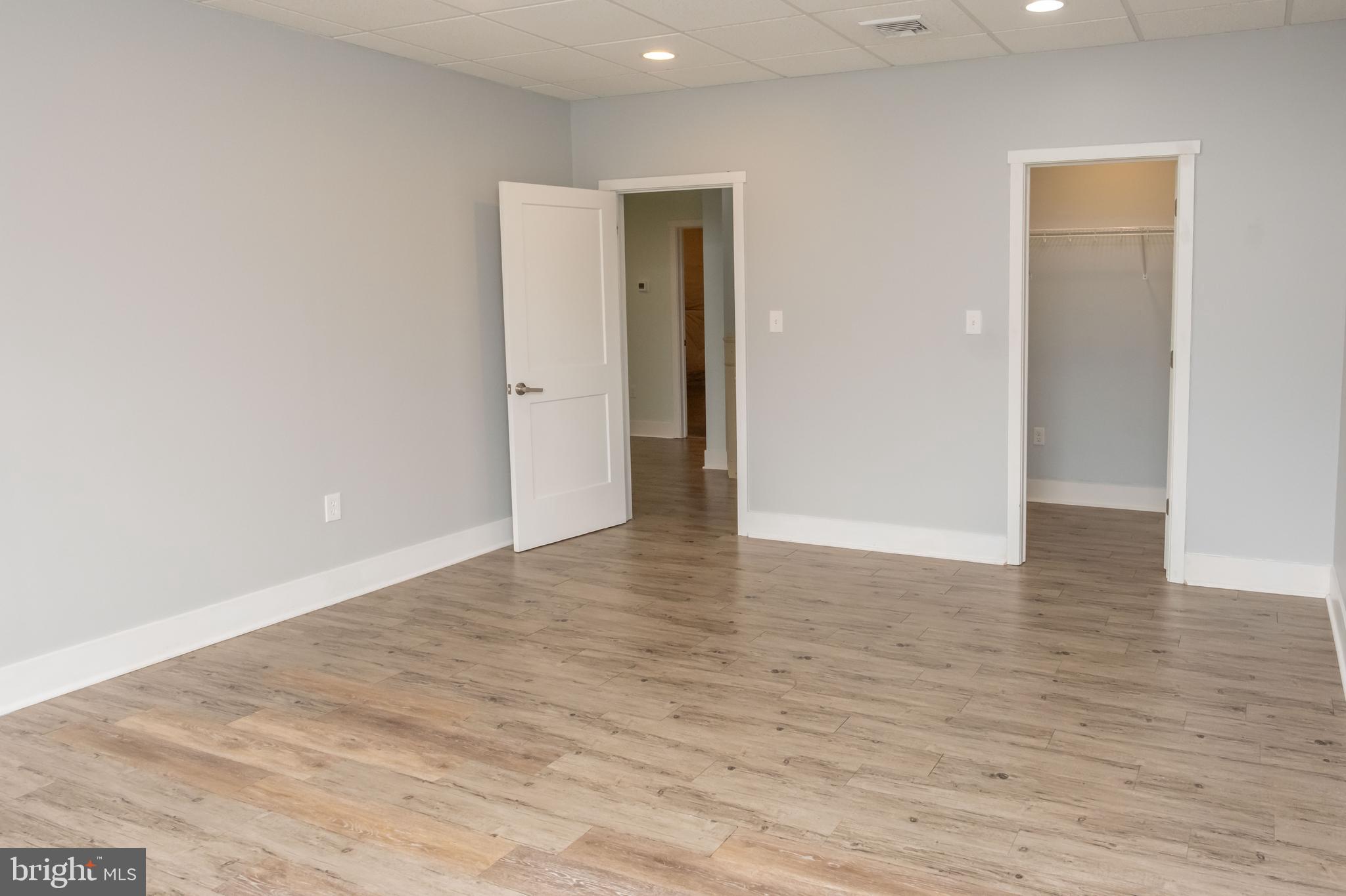 6042 Station Cir Road Harrisburg, PA 17111 - Photo 63 of 71 a view of an empty room with wooden floor and closet