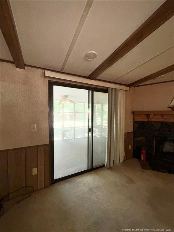 110 Kinton Drive Willow Spring, NC 27592 - Photo 11 of 50 a view of an empty room with a fireplace and a window