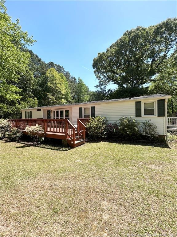 110 Kinton Drive Willow Spring, NC 27592 - Photo 2 of 50 a house view with swimming pool and wooden fence