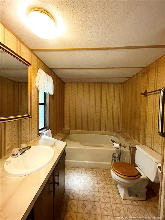 110 Kinton Drive Willow Spring, NC 27592 - Photo 22 of 50 a bathroom with a sink a toilet and shower