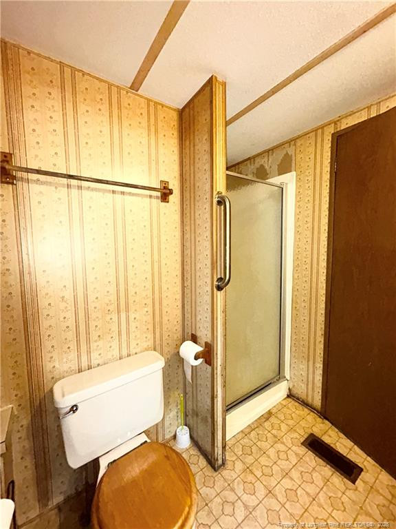 110 Kinton Drive Willow Spring, NC 27592 - Photo 23 of 50 a bathroom with a granite countertop sink toilet and shower