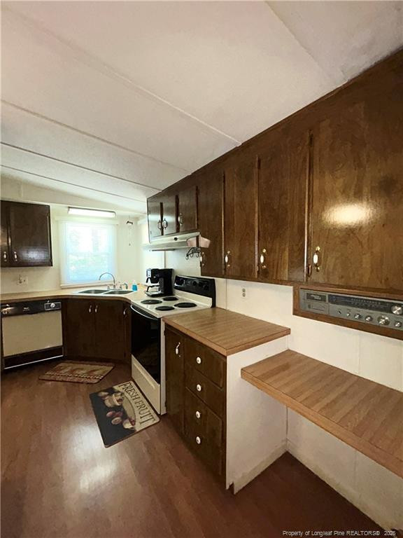 110 Kinton Drive Willow Spring, NC 27592 - Photo 29 of 50 a kitchen with stainless steel appliances kitchen island granite countertop a stove a sink and a microwave