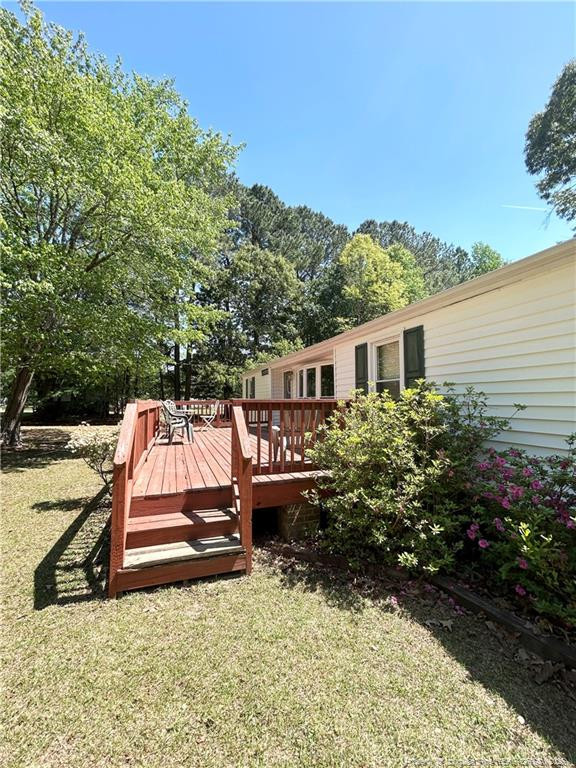 110 Kinton Drive Willow Spring, NC 27592 - Photo 3 of 50 a view of a house with backyard and sitting area