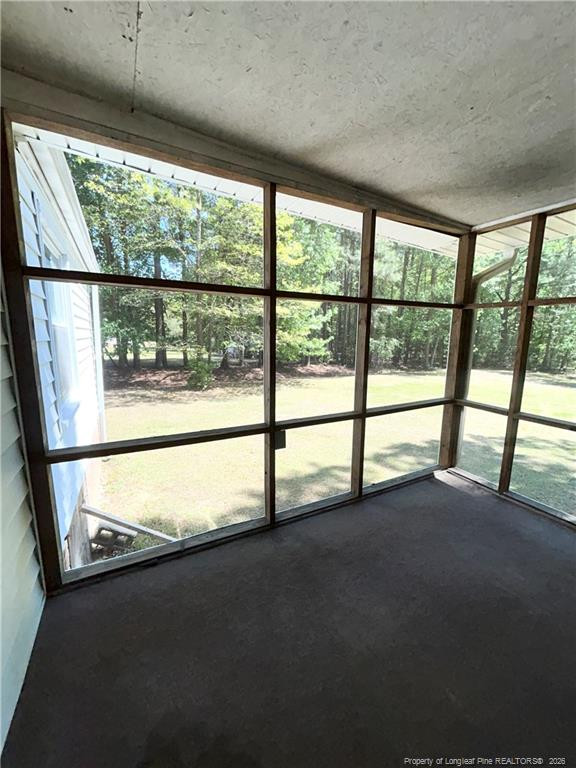 110 Kinton Drive Willow Spring, NC 27592 - Photo 33 of 50 a view of an empty room with a floor to ceiling window