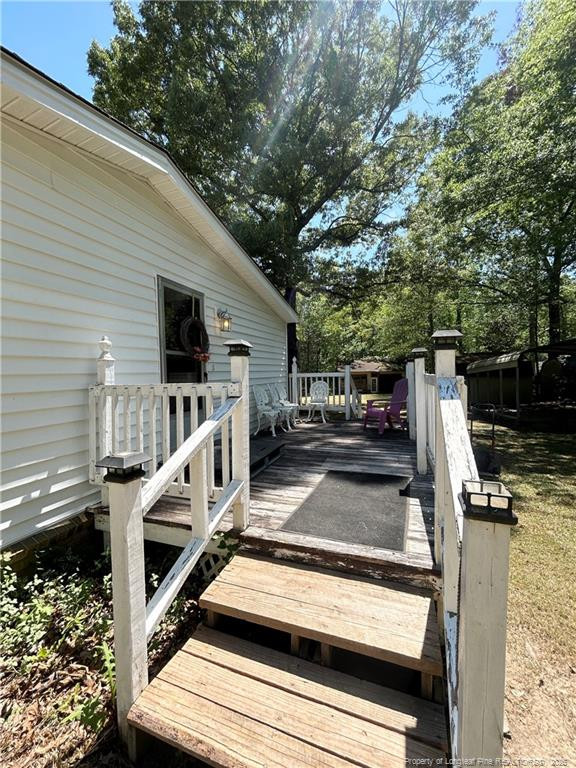 110 Kinton Drive Willow Spring, NC 27592 - Photo 36 of 50 a view of house with backyard and deck