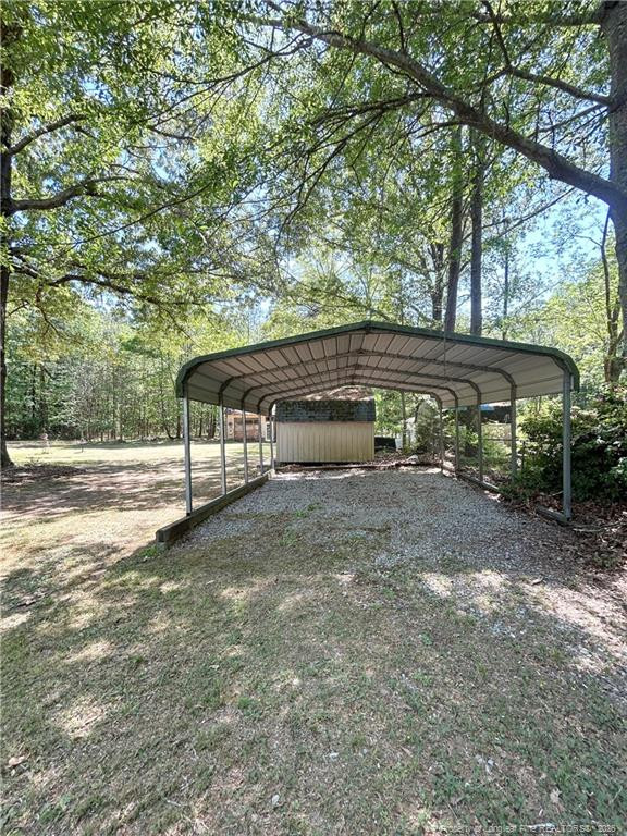 110 Kinton Drive Willow Spring, NC 27592 - Photo 37 of 50 a view of a house with backyard and trees