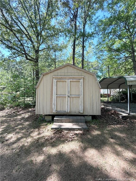 110 Kinton Drive Willow Spring, NC 27592 - Photo 39 of 50 a view of a small house covered with trees in the background